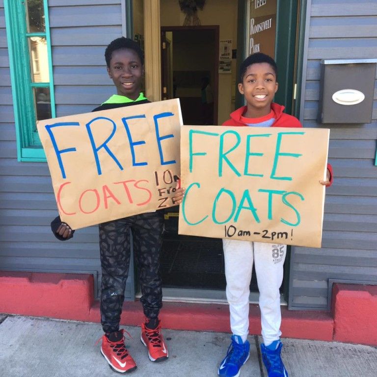 Kids holding signs